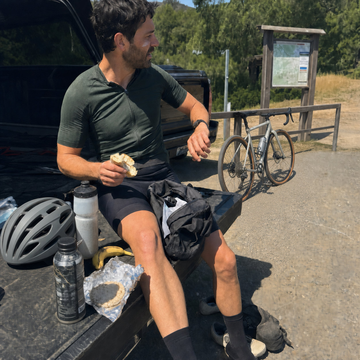 An amateur cyclist pausing during a long training day